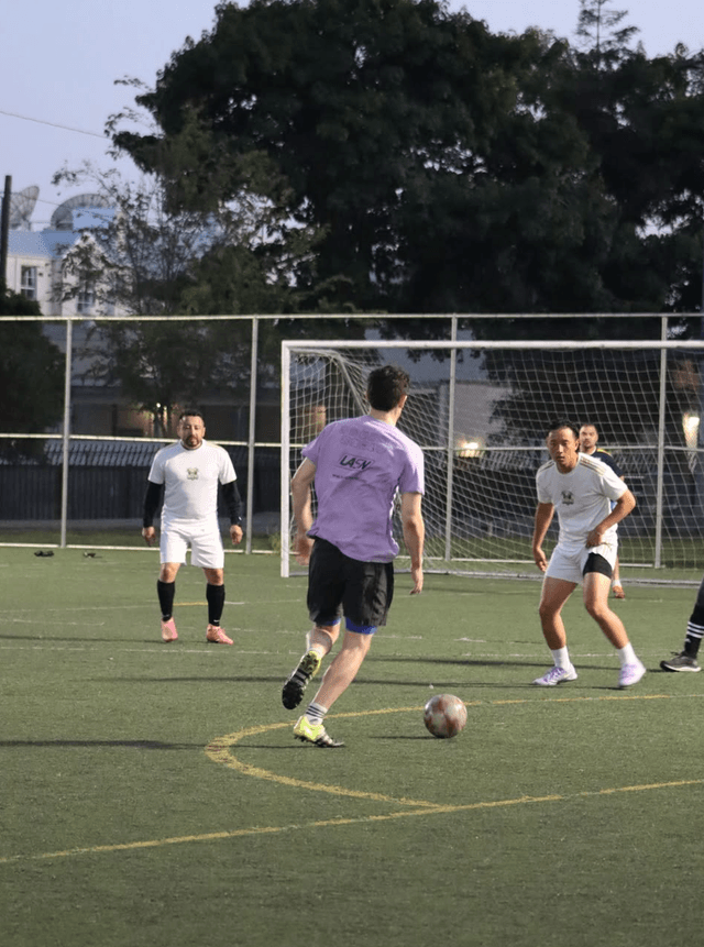 Players mingling at a post-game social event on a rooftop